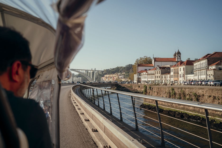 Scenic Tuk Tuk ride along the riverside in Porto, Portugal