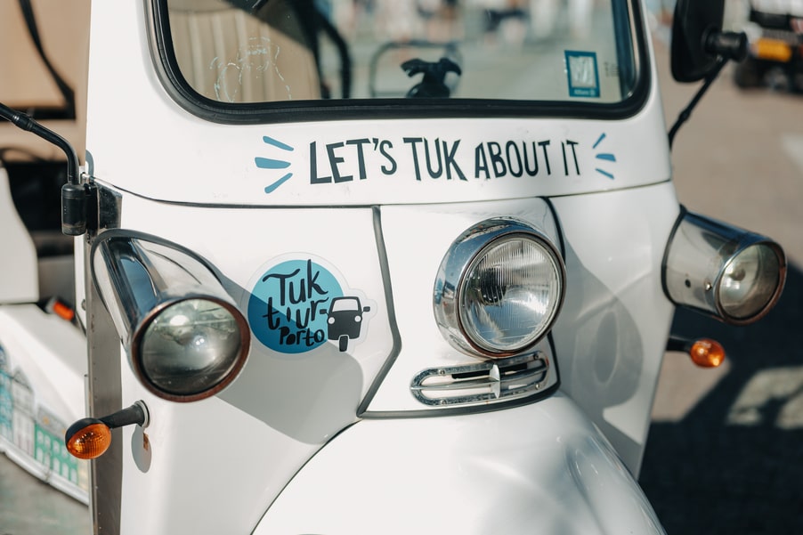 TukTuk Porto front view with city logo – Monastery and Cellars Tour