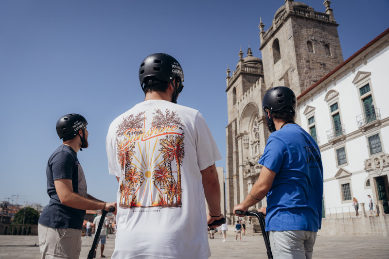 Travelers enjoying a Segway tour at Porto Cathedral square